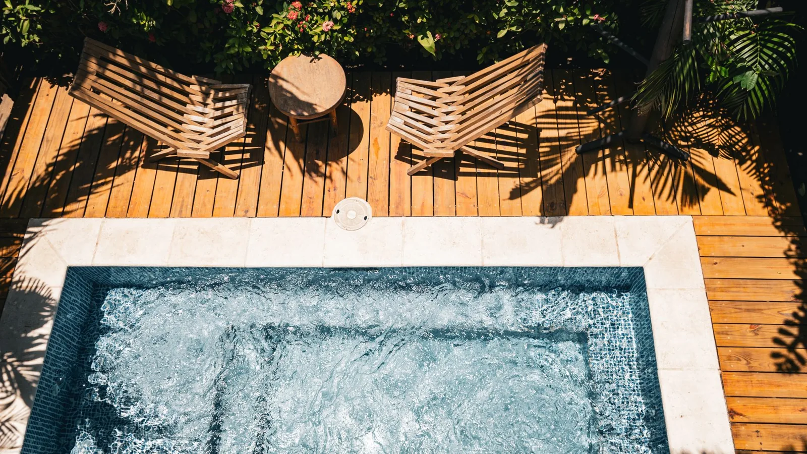 resort vs airbnb: poolside resort loungers versus a private vacation rental kitchen