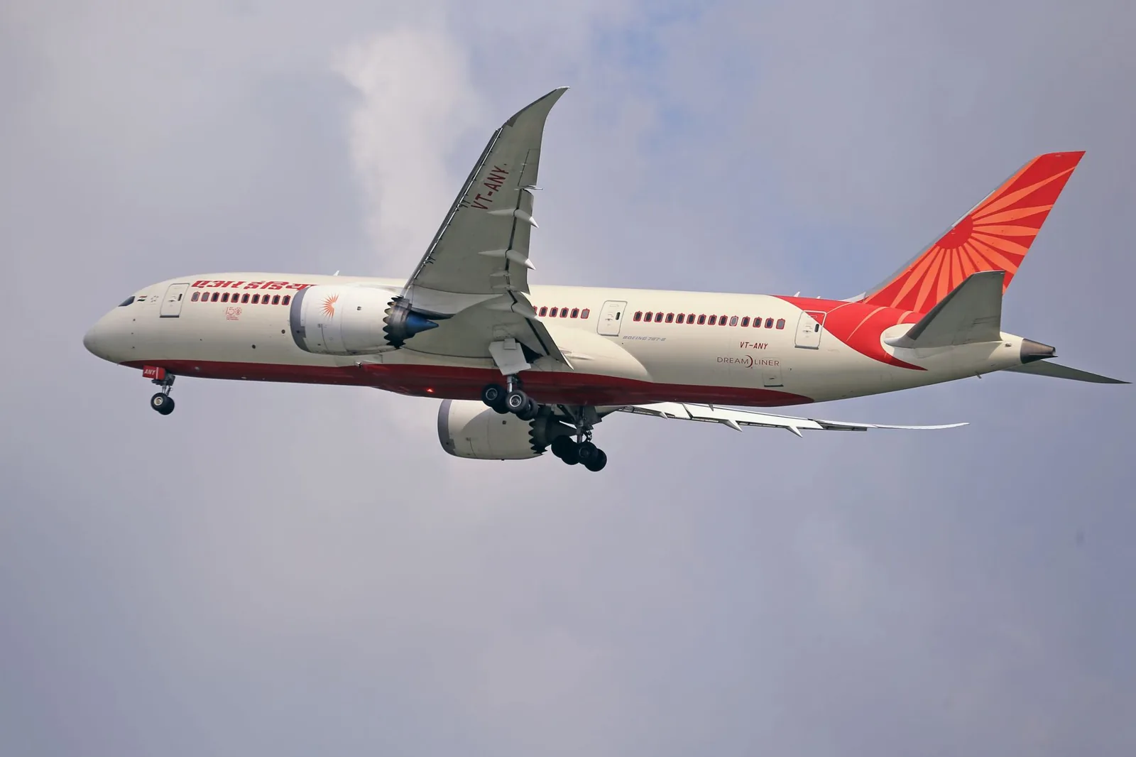 Booking a flight and reviewing fare breakdown on a laptop