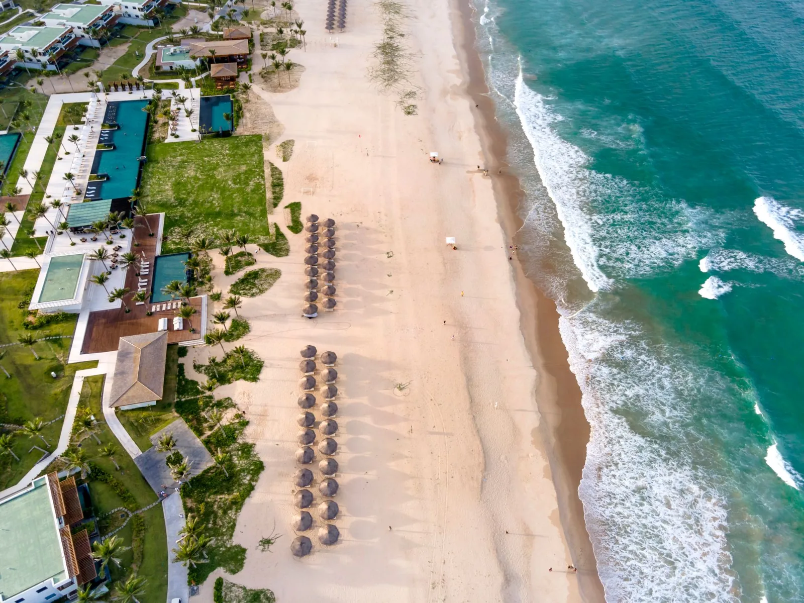 Couple relaxing in a beachfront suite at a luxury resort booked at a discounted rate