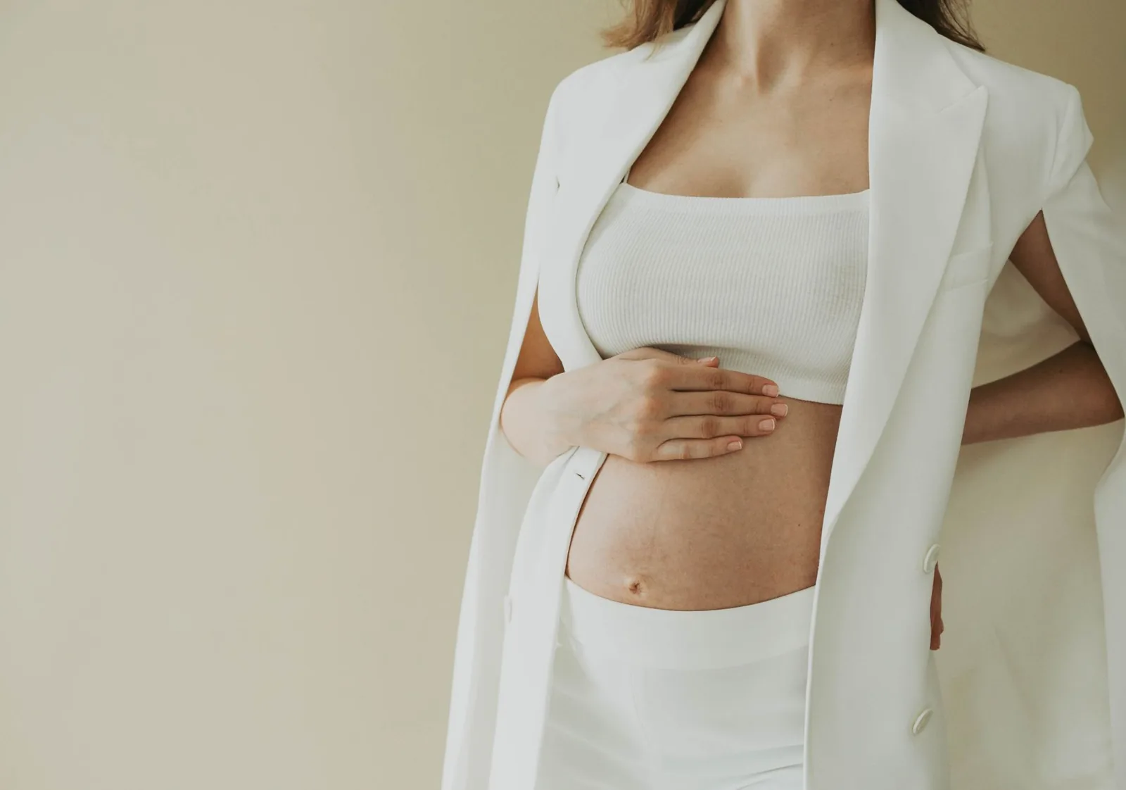 Pregnant traveler reviewing a travel insurance policy